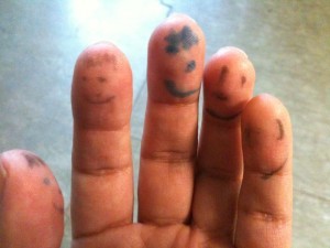 faces drawn on fingers